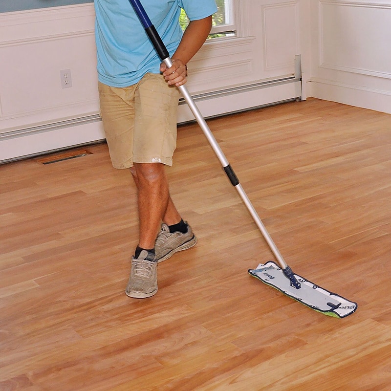 sweeping wood floor