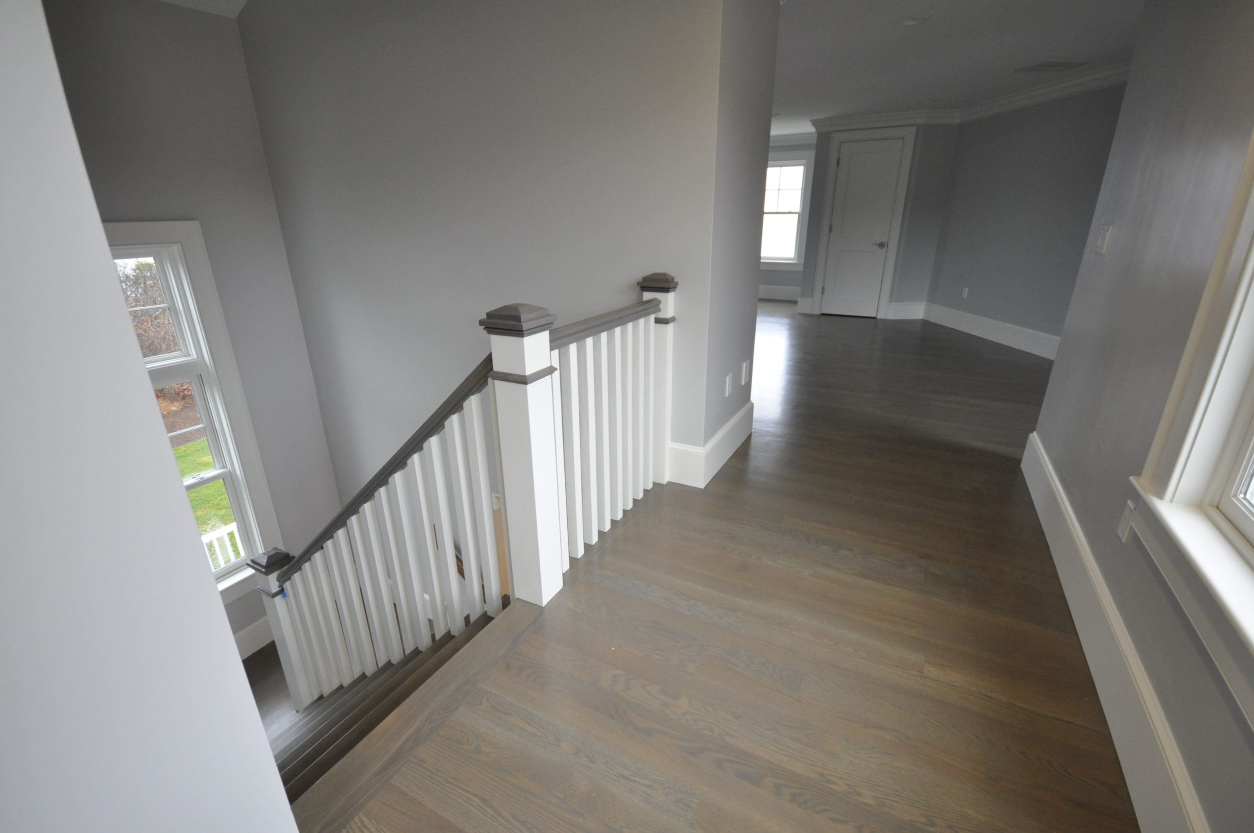 grey stained upstairs hallway